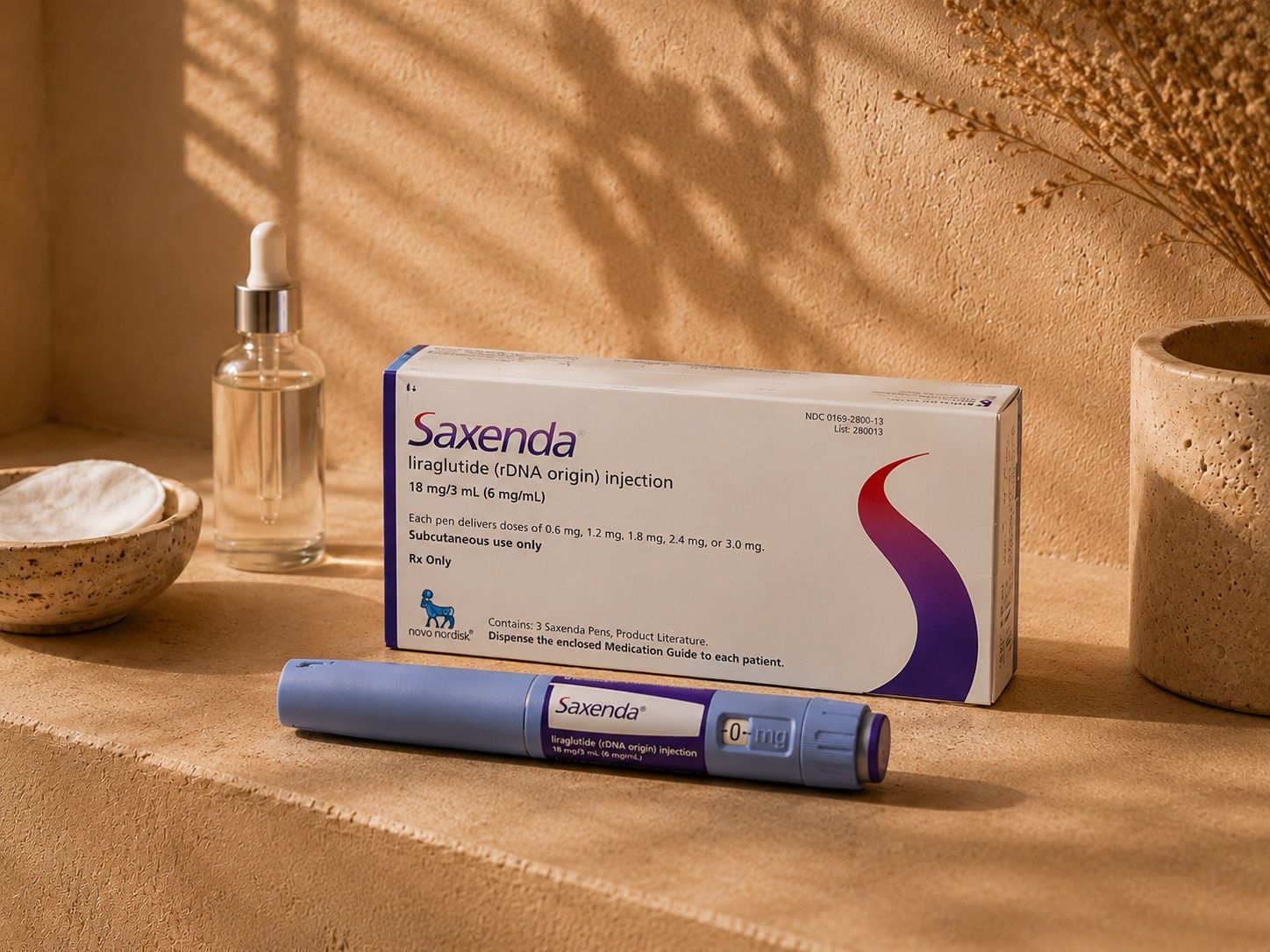 Savenda medication box and purple injection pen on a light brown surface.