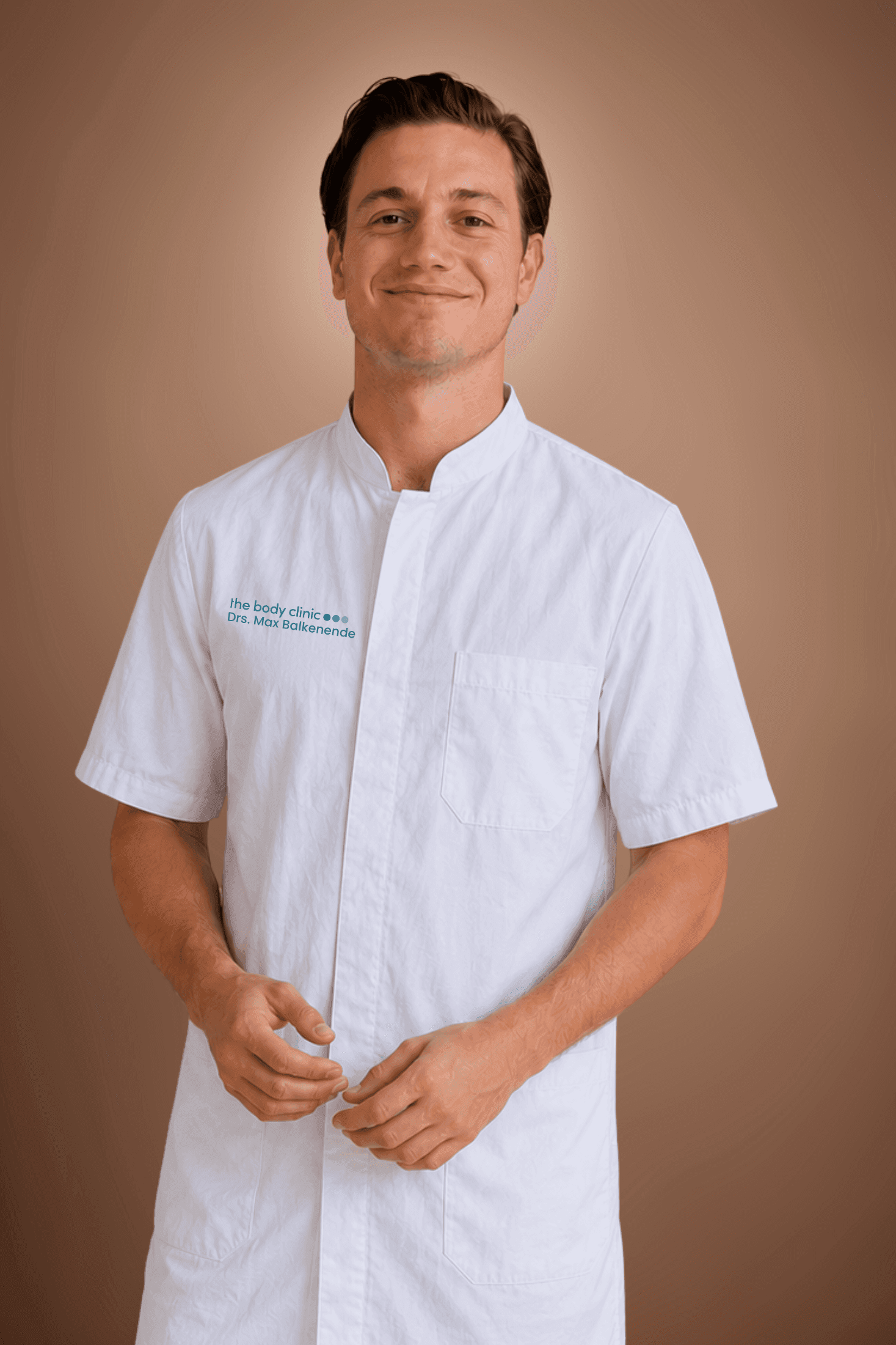 Young male medical professional in a white lab coat smiling confidently at the camera.
