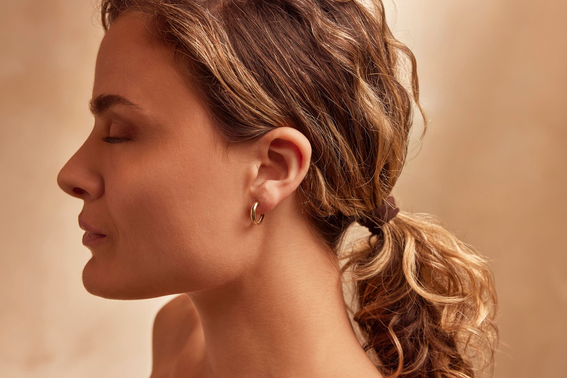 Client met strakke, jonge huid na lasertherapie tegen fijne lijntjes bij The Body Clinic