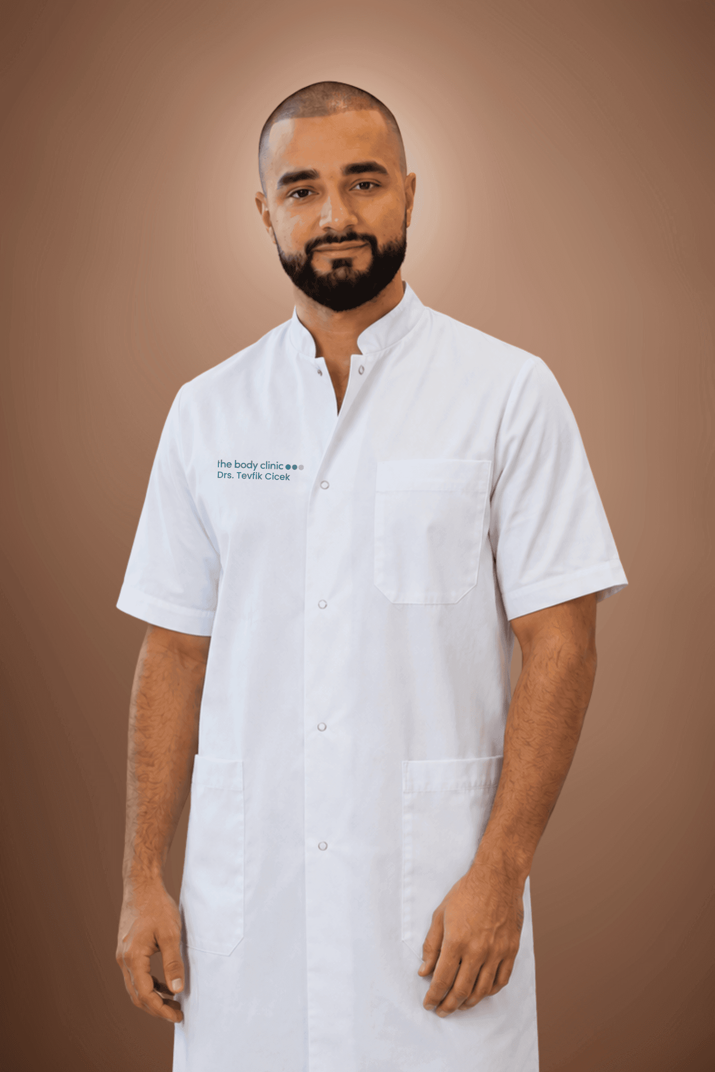 Professional man with a beard in a white medical uniform looking forward.
